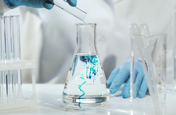 Chemist Pouring Substance Into Conical Flask With Liquid, Chemical Experiment